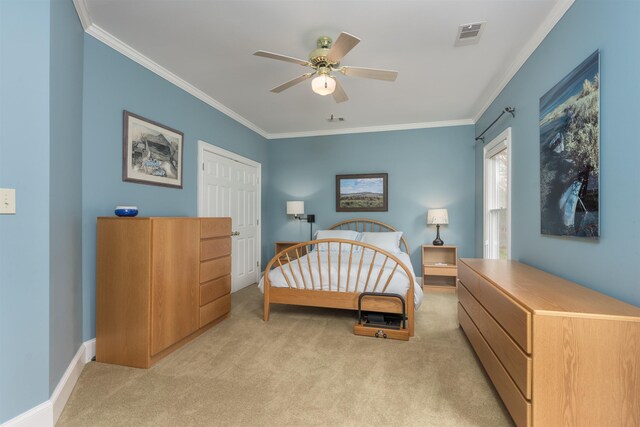 carpeted bedroom with crown molding and ceiling fan