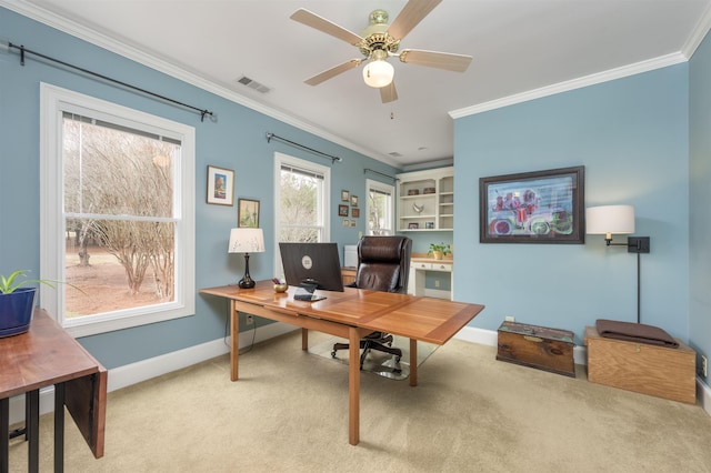 home office with ornamental molding, ceiling fan, and carpet flooring