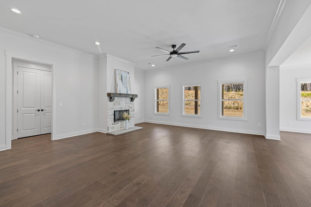 unfurnished living room with visible vents, ornamental molding, a fireplace, ceiling fan, and dark wood-style flooring