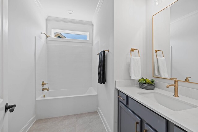 bathroom with vanity, baseboards, crown molding, bathing tub / shower combination, and tile patterned floors