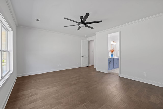 empty room with baseboards, dark wood-type flooring, a ceiling fan, and ornamental molding