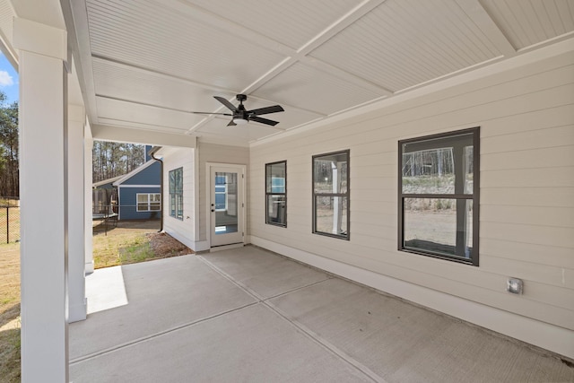 view of patio featuring fence and ceiling fan