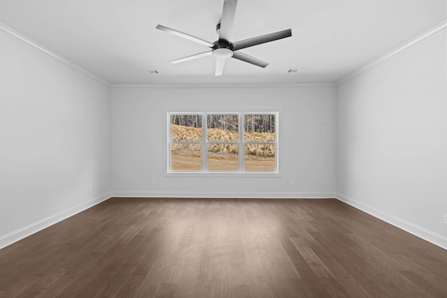 spare room featuring dark wood-type flooring, baseboards, crown molding, and ceiling fan