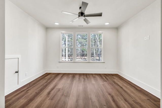 spare room with wood-type flooring and ceiling fan