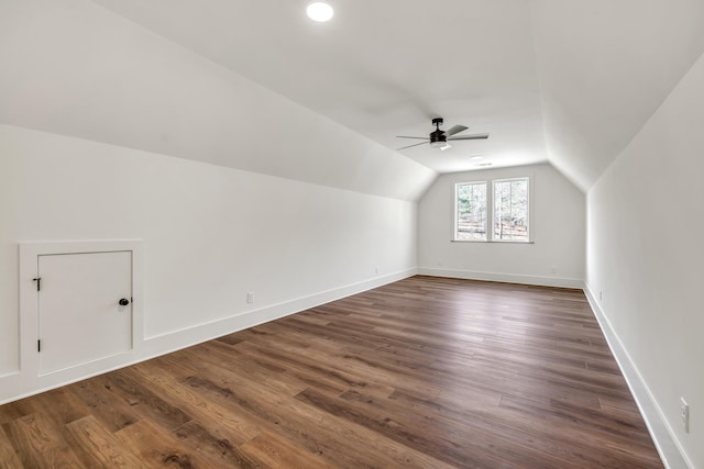 additional living space featuring vaulted ceiling, ceiling fan, and dark hardwood / wood-style flooring