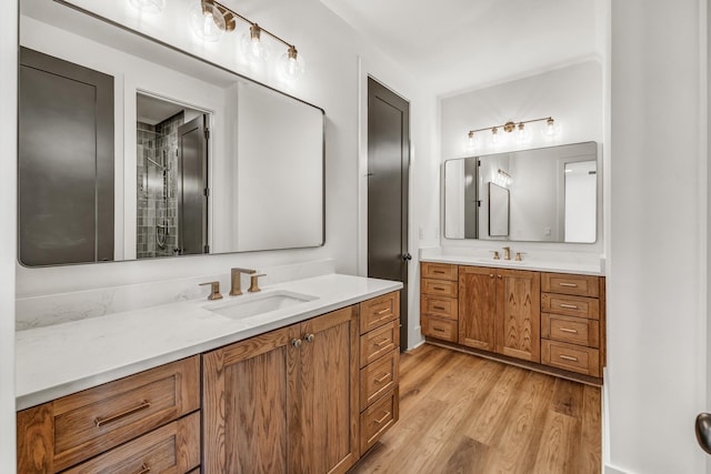 bathroom with vanity and hardwood / wood-style floors