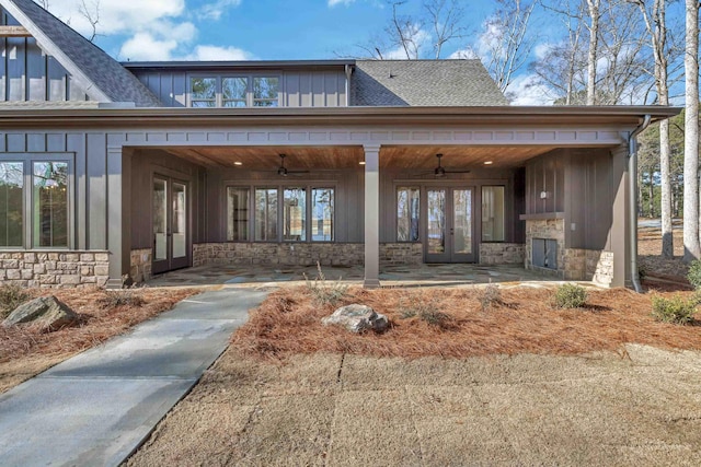 view of exterior entry featuring french doors and ceiling fan