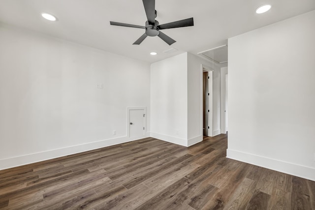 spare room with ceiling fan and dark hardwood / wood-style flooring