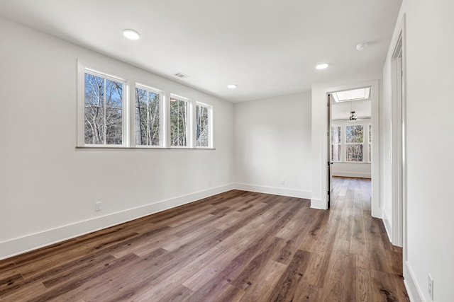 empty room with hardwood / wood-style floors