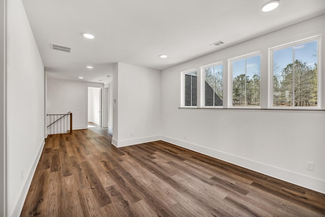 empty room featuring dark wood-type flooring