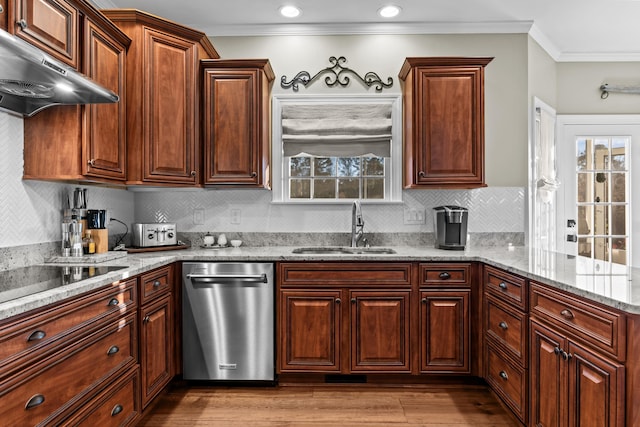 1290 Reid Duvall Rd, Madison, GA 30650 - kitchen with stainless steel dishwasher, a sink, under cabinet range hood, ornamental molding, and wood finished floors