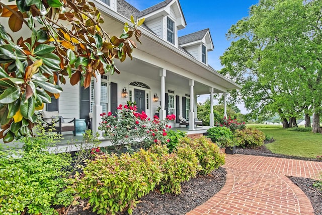 1290 Reid Duvall Rd, Madison, GA 30650 - doorway to property with a porch, roof with shingles, and a lawn