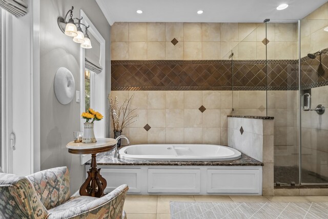 bathroom with tile patterned flooring, plus walk in shower, and tile walls