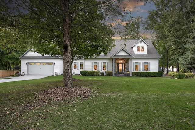 view of front facade featuring a yard and a garage