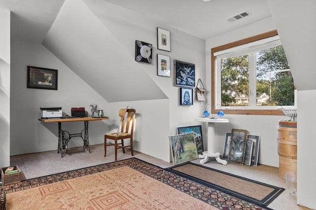 home office with lofted ceiling