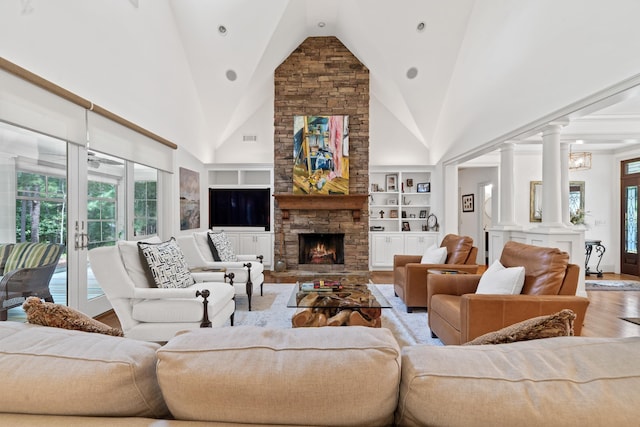 1191 Linger Longer Dr, Greensboro, GA 30642 - living area with wood finished floors, healthy amount of natural light, built in shelves, and high vaulted ceiling