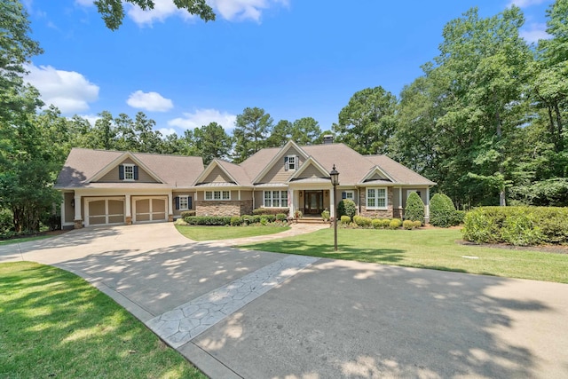 1191 Linger Longer Dr, Greensboro, GA 30642 - craftsman-style home featuring driveway, stone siding, a front lawn, a chimney, and an attached garage