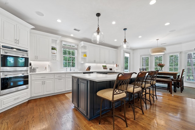1191 Linger Longer Dr, Greensboro, GA 30642 - kitchen featuring double oven, open shelves, light countertops, white cabinetry, and recessed lighting