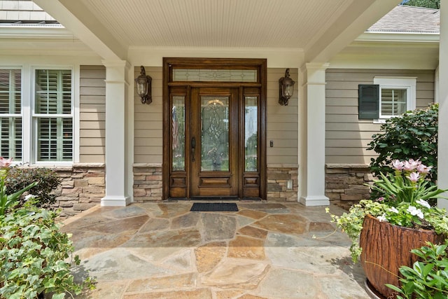 1191 Linger Longer Dr, Greensboro, GA 30642 - entrance to property featuring stone siding and covered porch