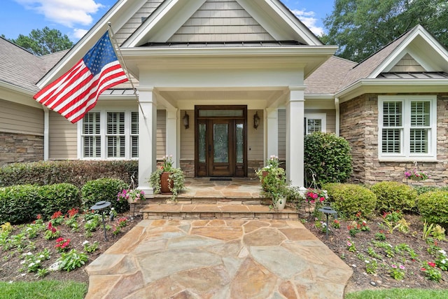 1191 Linger Longer Dr, Greensboro, GA 30642 - entrance to property with stone siding, roof with shingles, and a porch