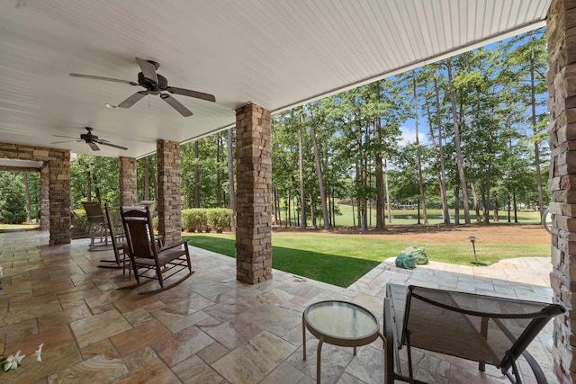 1191 Linger Longer Dr, Greensboro, GA 30642 - view of patio / terrace featuring outdoor dining space, ceiling fan, and view of wooded area