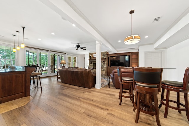 1191 Linger Longer Dr, Greensboro, GA 30642 - dining room featuring plenty of natural light, a fireplace, ceiling fan, recessed lighting, and light wood finished floors