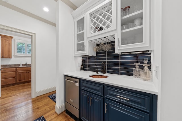 1191 Linger Longer Dr, Greensboro, GA 30642 - indoor wet bar with stainless steel dishwasher, crown molding, tasteful backsplash, light wood-style floors, and recessed lighting
