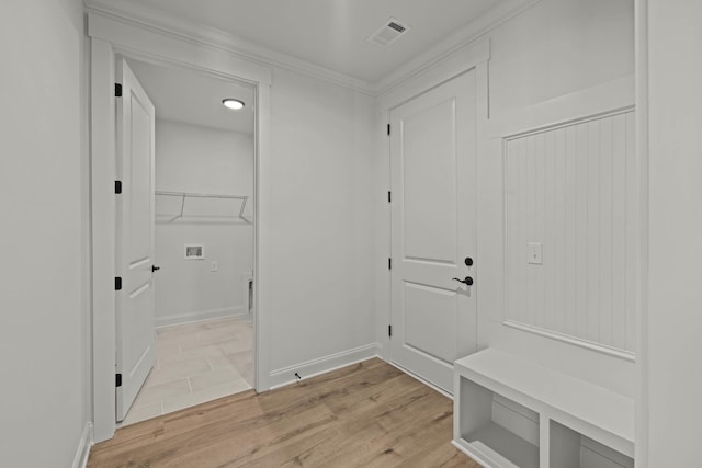 mudroom with light wood-style flooring, visible vents, and baseboards