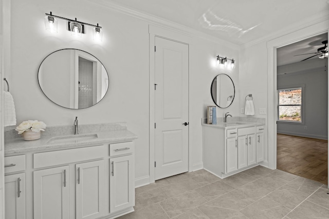 full bathroom with a ceiling fan, ornamental molding, two vanities, and a sink