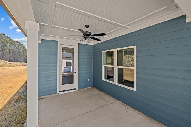 doorway to property featuring a ceiling fan and a patio