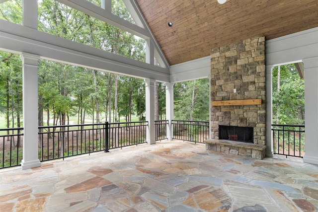 view of patio featuring an outdoor stone fireplace