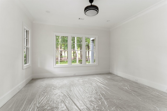 unfurnished room featuring crown molding