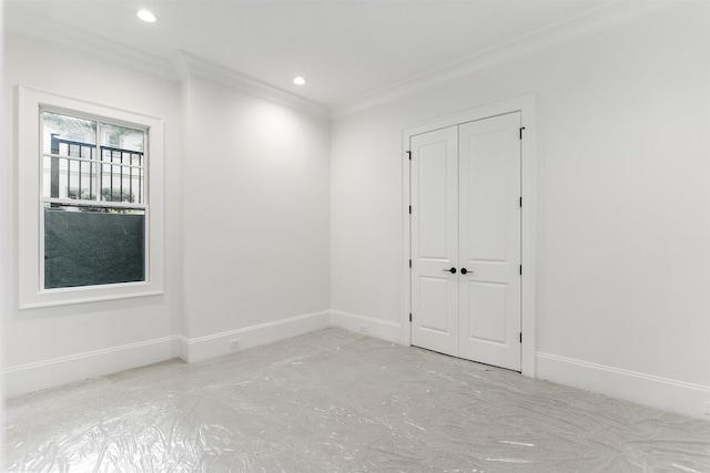 spare room featuring crown molding