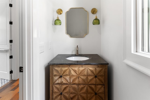 bathroom with vanity and hardwood / wood-style floors