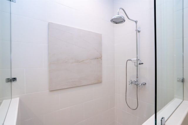 bathroom with tiled shower