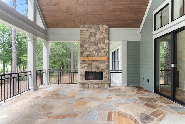 view of patio with an outdoor stone fireplace