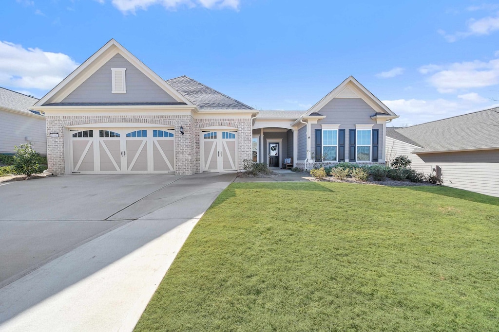 view of front facade with a garage and a front yard