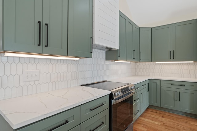 631 Susan Davis Rd, Sparta, GA 31087 - kitchen with green cabinets, stainless steel range with electric cooktop, and light stone counters