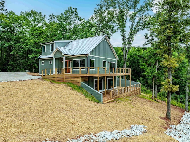 631 Susan Davis Rd, Sparta, GA 31087 - view of front of house with a standing seam roof, metal roof, board and batten siding, and a wooden deck