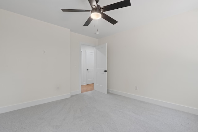 631 Susan Davis Rd, Sparta, GA 31087 - empty room featuring light colored carpet, baseboards, and ceiling fan