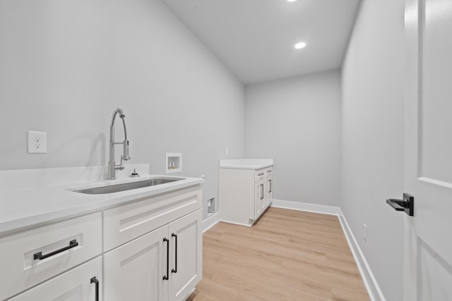 631 Susan Davis Rd, Sparta, GA 31087 - laundry room with cabinet space, hookup for a washing machine, light wood-style floors, recessed lighting, and baseboards