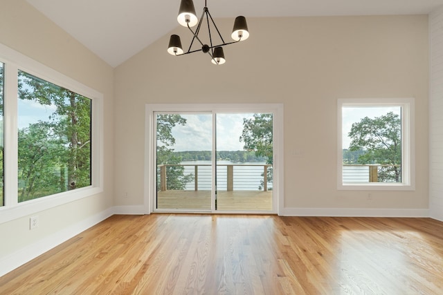 631 Susan Davis Rd, Sparta, GA 31087 - unfurnished room featuring a chandelier, light wood-type flooring, lofted ceiling, and baseboards