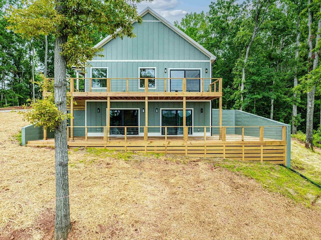 631 Susan Davis Rd, Sparta, GA 31087 - rear view of house featuring board and batten siding and a wooden deck