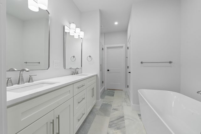 631 Susan Davis Rd, Sparta, GA 31087 - full bath featuring marble finish flooring, a freestanding bath, double vanity, and recessed lighting