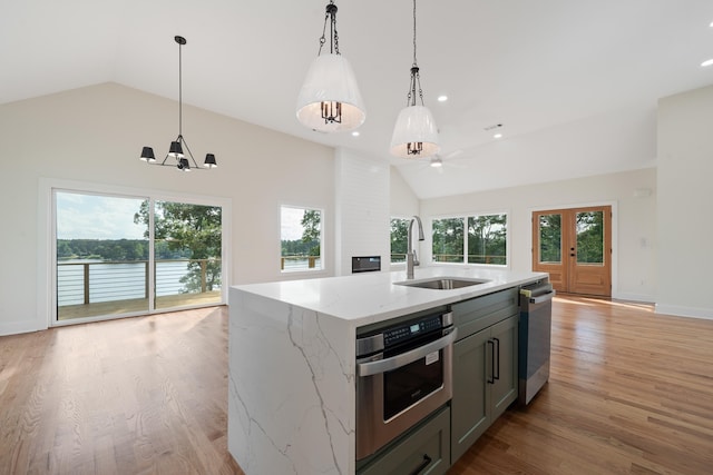 631 Susan Davis Rd, Sparta, GA 31087 - kitchen with a sink, appliances with stainless steel finishes, open floor plan, decorative light fixtures, and recessed lighting
