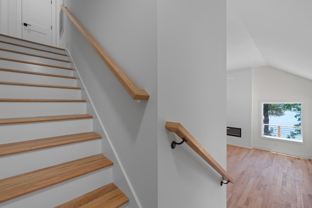 631 Susan Davis Rd, Sparta, GA 31087 - staircase featuring lofted ceiling and wood finished floors