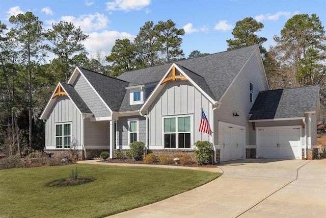 modern farmhouse featuring concrete driveway, board and batten siding, and a front yard