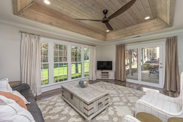 living room with a raised ceiling, crown molding, wood ceiling, and light hardwood / wood-style flooring