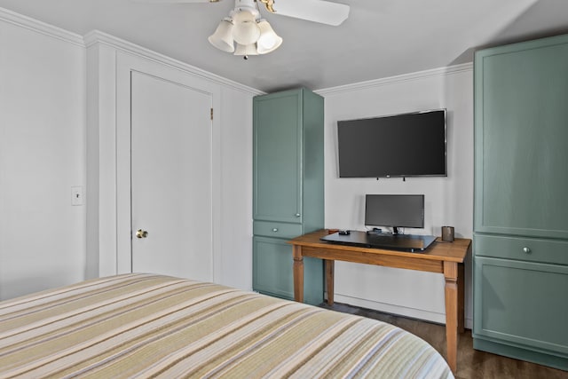 bedroom featuring ornamental molding, ceiling fan, and dark wood-type flooring