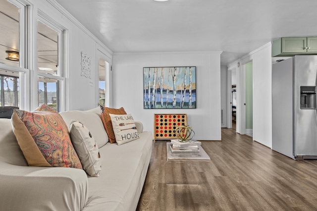 living room with ornamental molding and hardwood / wood-style floors